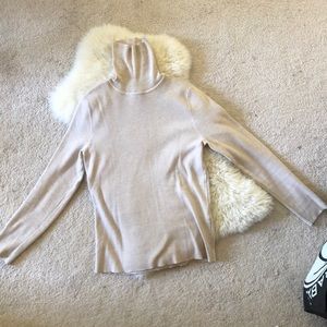 Tan colored turtle neck used lightly